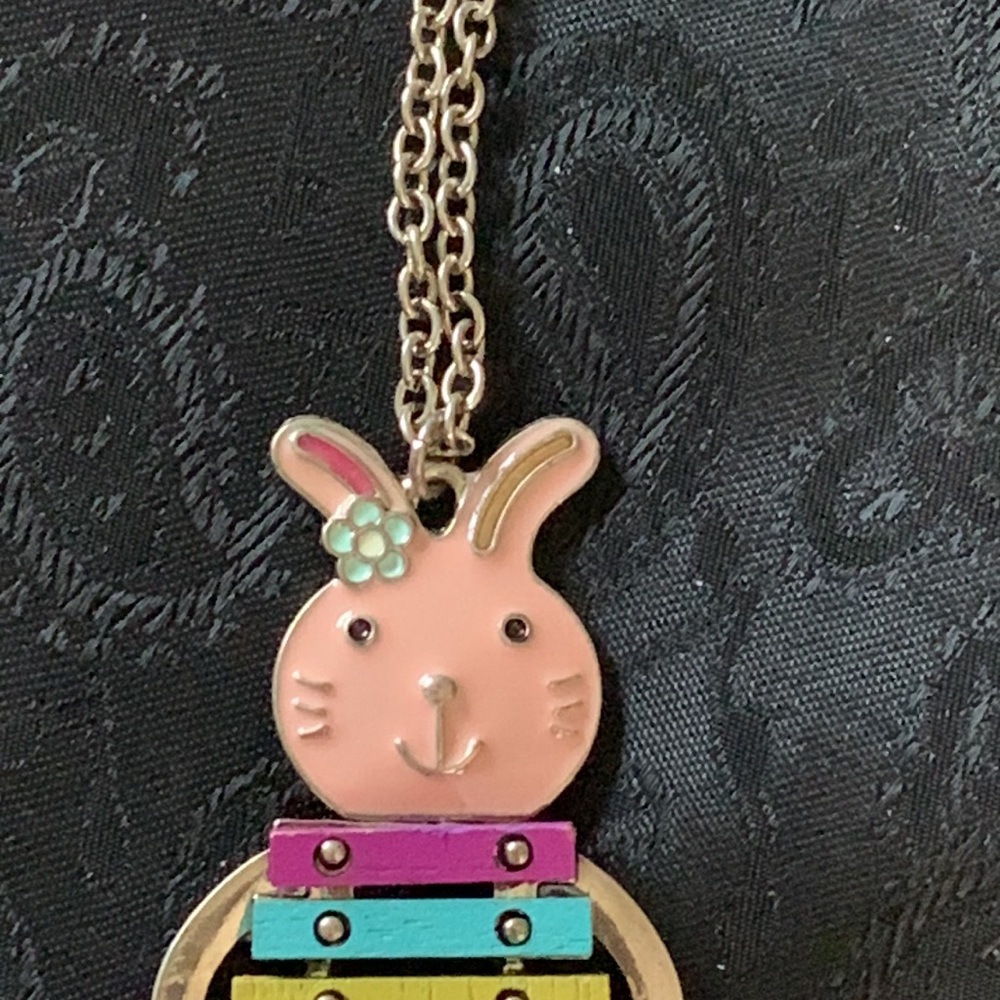 This Necklace Features an Enameled Rabbit Playing a Wooden Colorful Xylophone - Picture 4 of 6